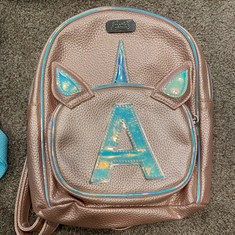 Like new initial “A” mini backpack